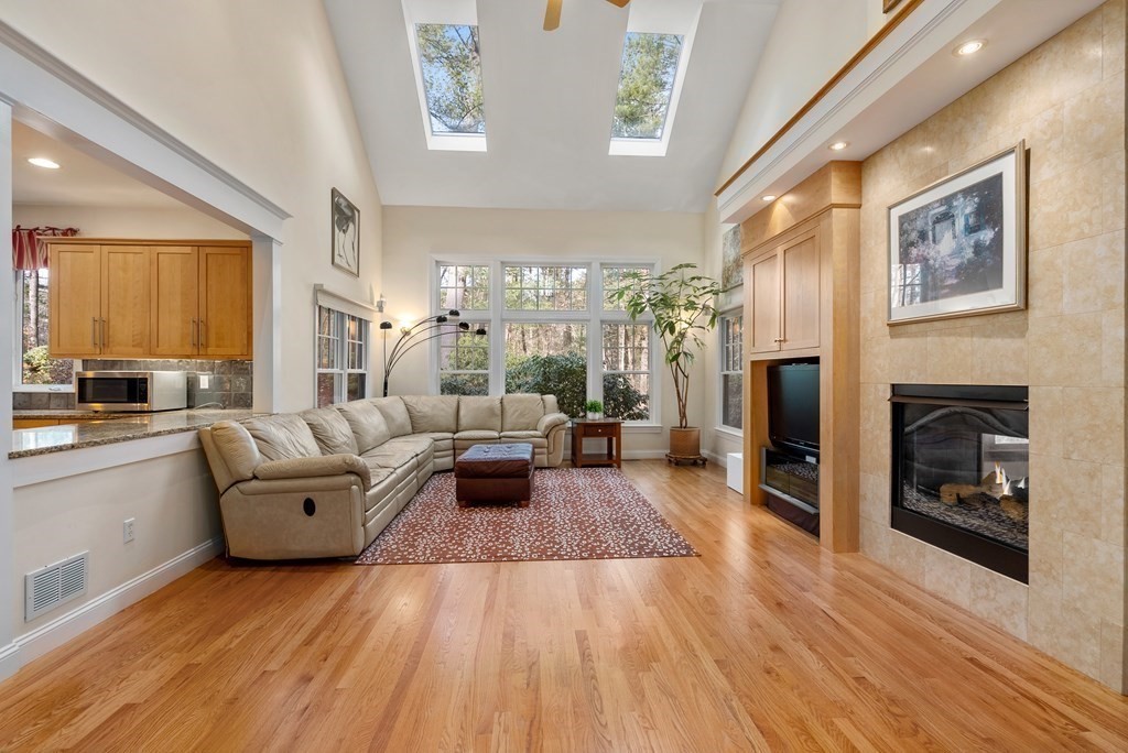 353 Dutton Road Sudbury, MA 01776 - Photo 7 of 42 a living room with furniture and a fireplace