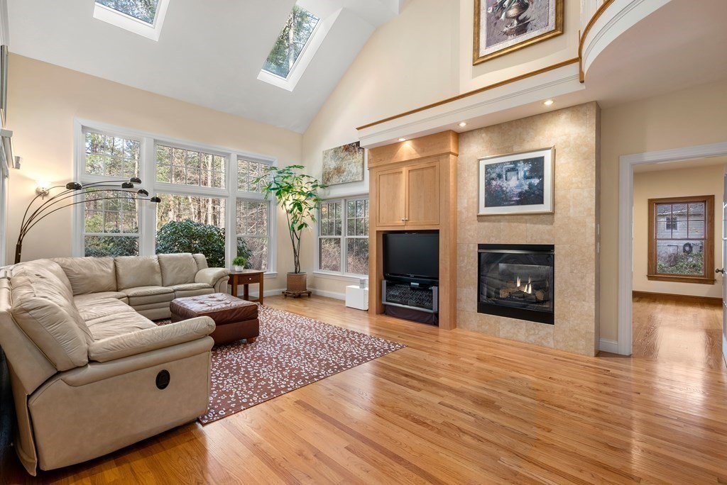 353 Dutton Road Sudbury, MA 01776 - Photo 8 of 42 a living room with furniture and a flat screen tv