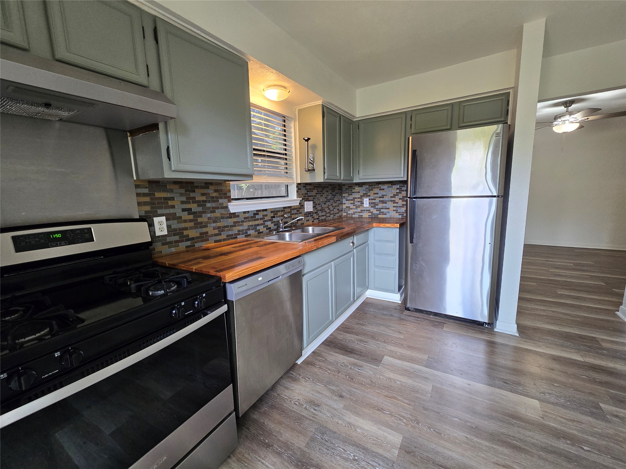 2003 Kenneth Avenue, Unit B Austin, TX 78741 - Photo 5 of 19 Warm wood countertops complement custom cabinetry and stainless steel appliances in this efficient workspace.