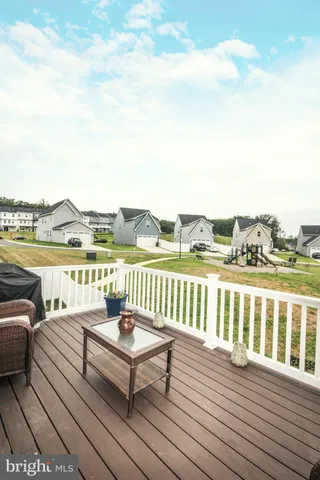 a view of a terrace with wooden floor and lake view