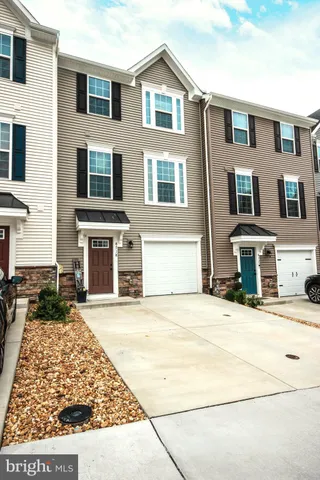 a front view of a house with yard