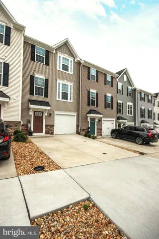 a front view of a building with many windows