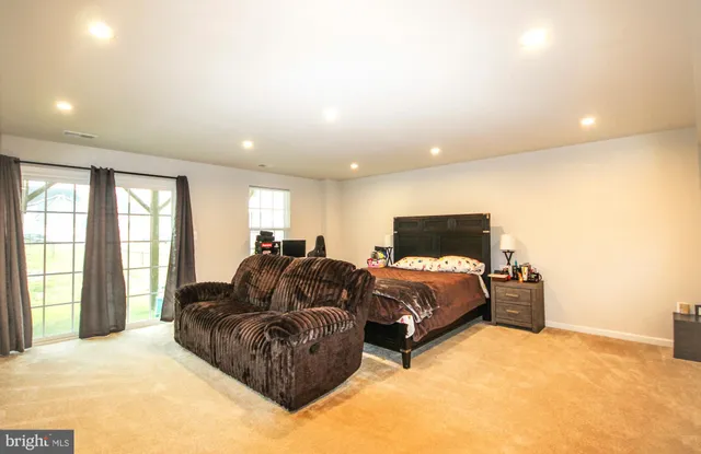 a bed room with bed and window