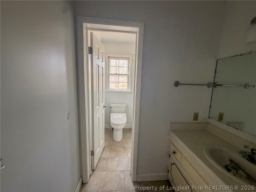 575 Veterans Road St. Pauls, NC 28384 - Photo 10 of 27 a bathroom with a sink and toilet