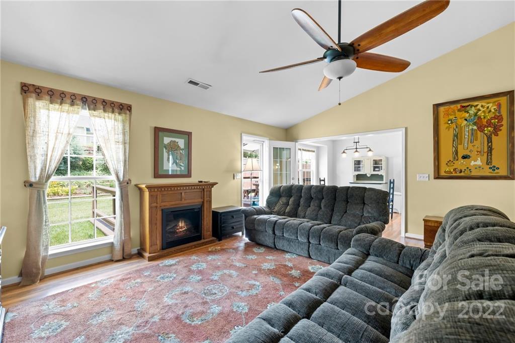 198 Lumber River Road Fletcher, NC 28732 - Photo 12 of 39 a living room with furniture and a fireplace