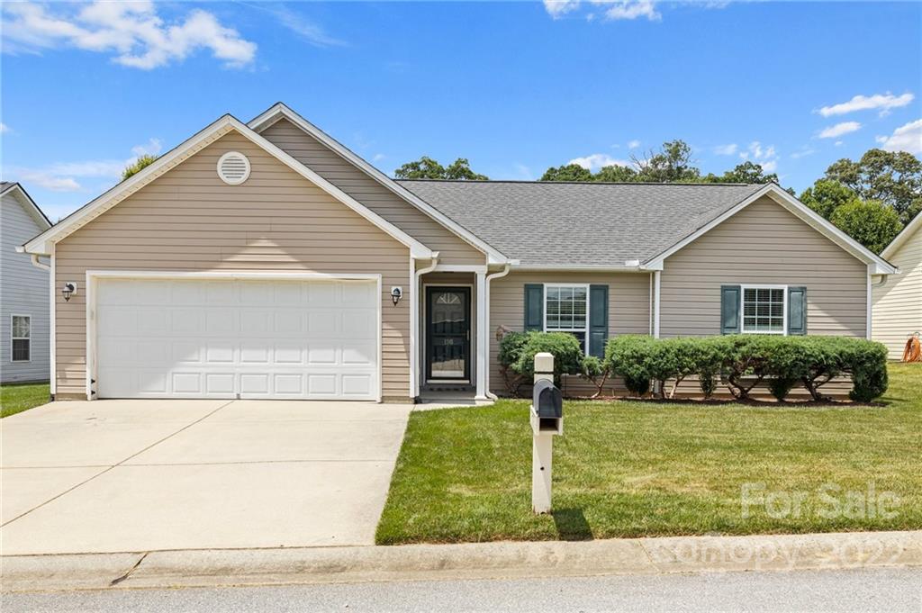 198 Lumber River Road Fletcher, NC 28732 - Photo 2 of 39 a front view of a house with a yard