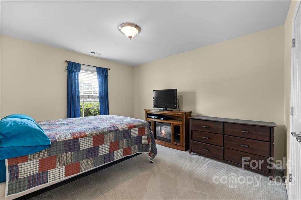 198 Lumber River Road Fletcher, NC 28732 - Photo 26 of 39 a bedroom with a bed and furniture