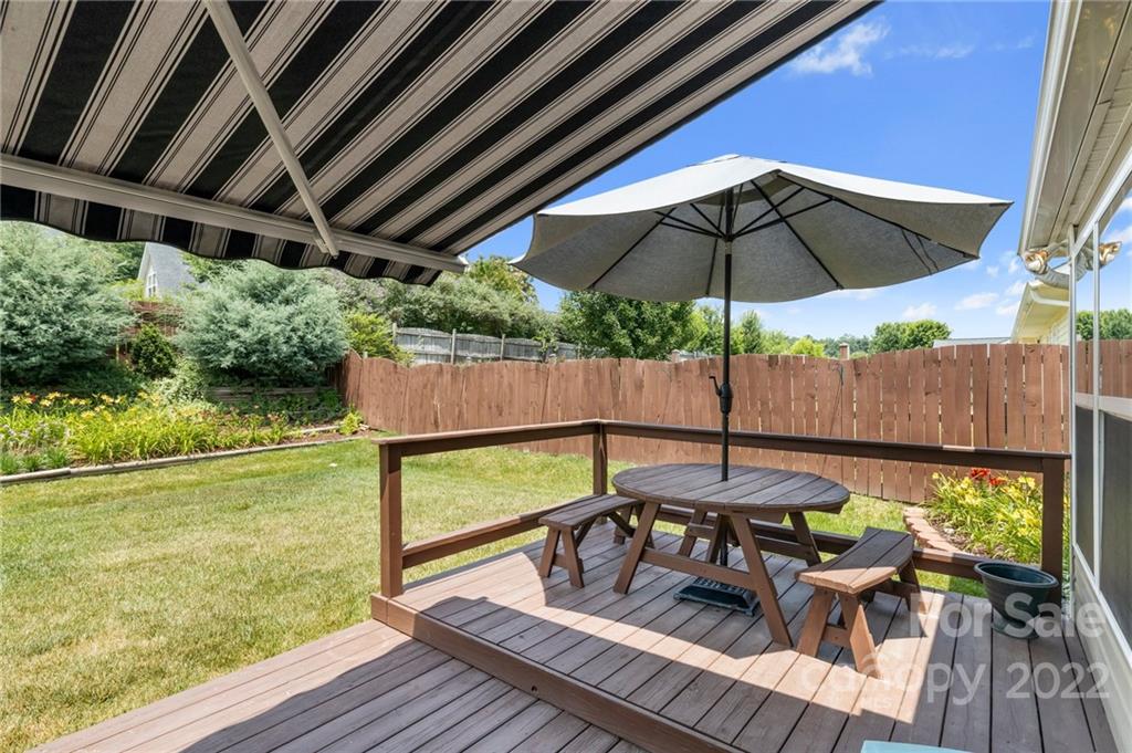 198 Lumber River Road Fletcher, NC 28732 - Photo 28 of 39 a view of a outdoor sitting area with furniture and umbrella