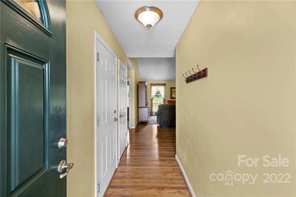 198 Lumber River Road Fletcher, NC 28732 - Photo 7 of 39 a view of a hallway with wooden floor
