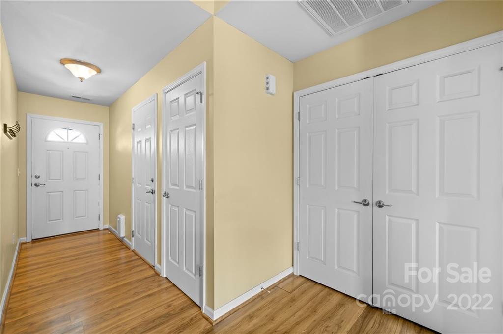 198 Lumber River Road Fletcher, NC 28732 - Photo 8 of 39 a view of a hallway with wooden floor and closet area