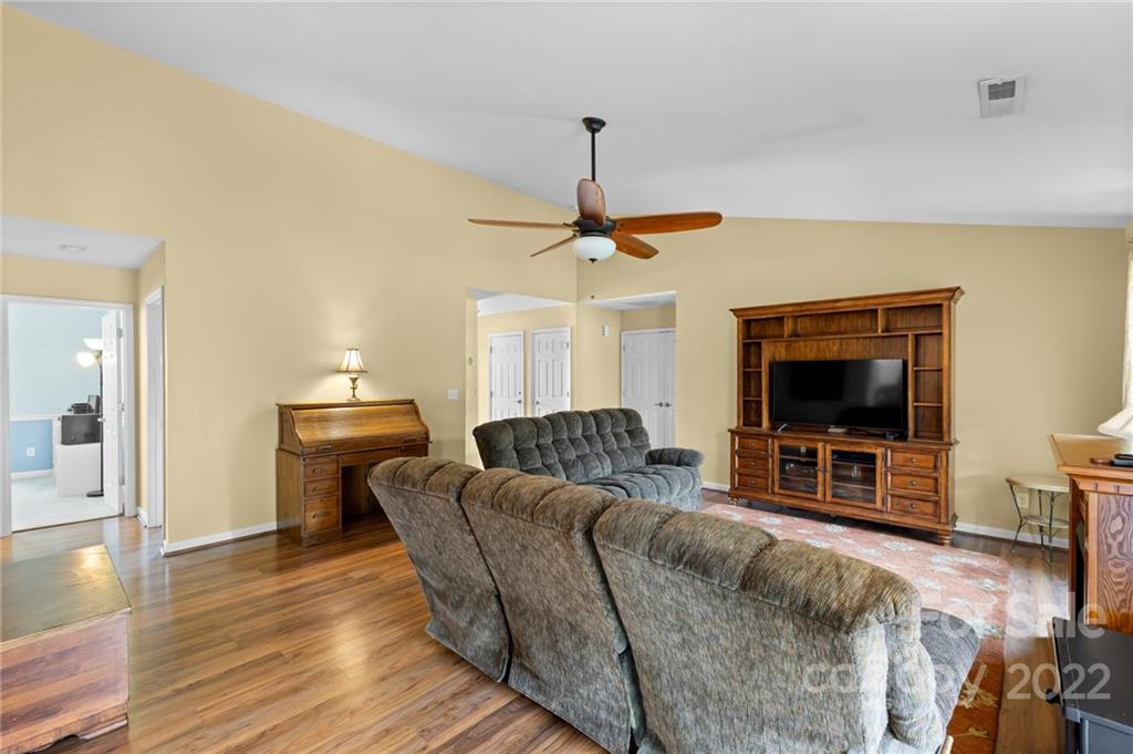 198 Lumber River Road Fletcher, NC 28732 - Photo 9 of 39 a living room with furniture and a flat screen tv