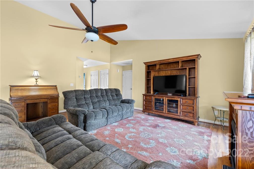 198 Lumber River Road Fletcher, NC 28732 - Photo 10 of 39 a living room with furniture and a flat screen tv