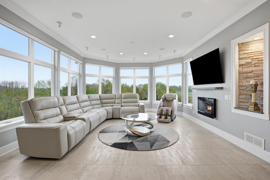 931 Pleasant Hill Road Wexford, PA 15090 - Photo 16 of 50 a living room with fireplace furniture and a flat screen tv