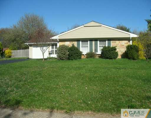 13 Sweetbriar Road Somerset, NJ 08873 - Photo 2 of 8 a front view of a house with a yard