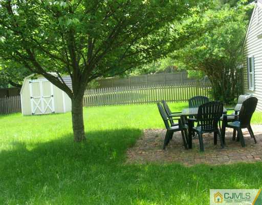 13 Sweetbriar Road Somerset, NJ 08873 - Photo 3 of 8 a view of a house with backyard and a sitting area