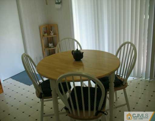 13 Sweetbriar Road Somerset, NJ 08873 - Photo 6 of 8 a view of a dining room with furniture and window