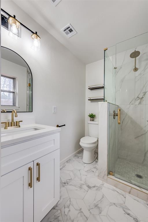624 Forest Lane Hurst, TX 76053 - Photo 23 of 25 Bathroom featuring vanity, a marble finish shower, and light marble finish floors