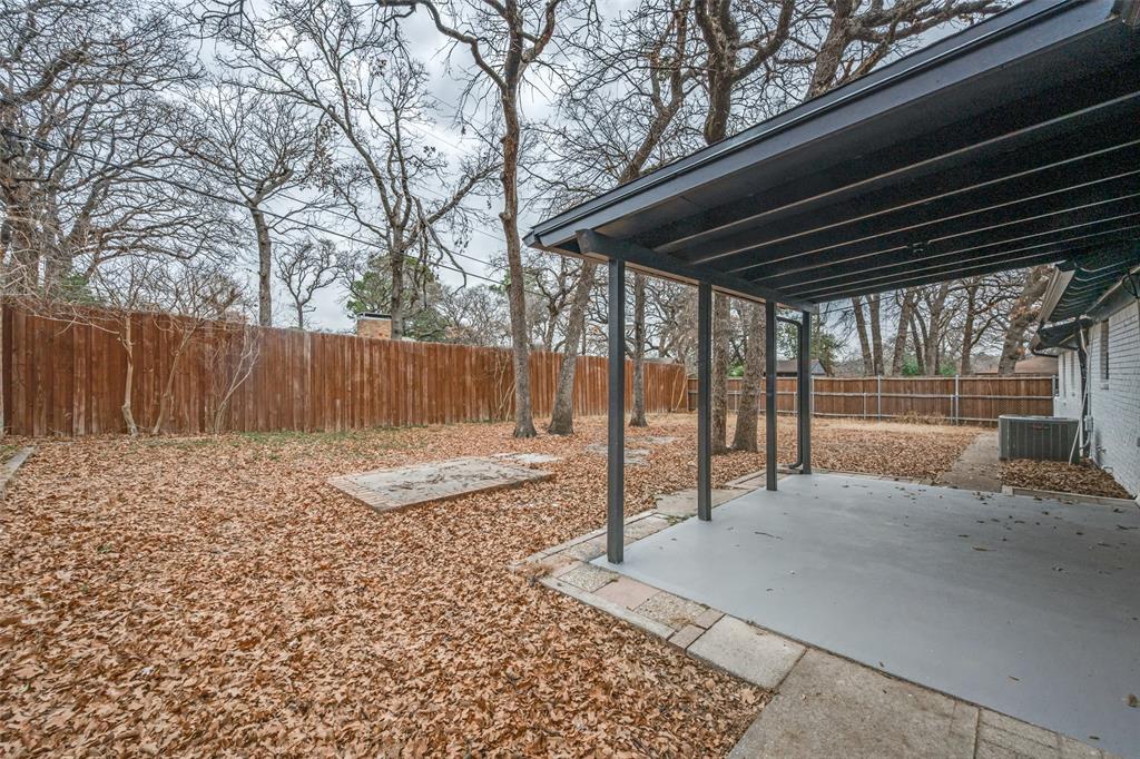 624 Forest Lane Hurst, TX 76053 - Photo 24 of 25 Fenced backyard featuring a patio area