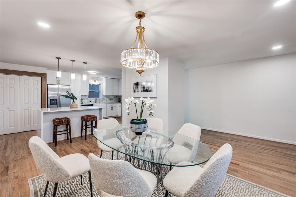624 Forest Lane Hurst, TX 76053 - Photo 5 of 25 Dining room with light wood finished floors and suspended lighting