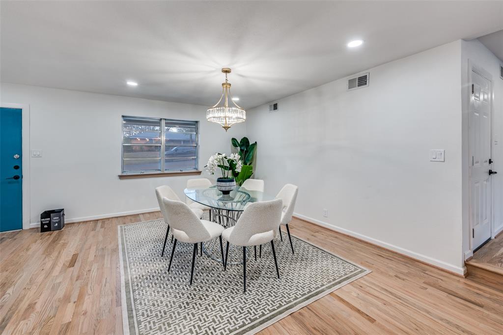 624 Forest Lane Hurst, TX 76053 - Photo 7 of 25 Dining space with suspended lighting and light wood finished floors