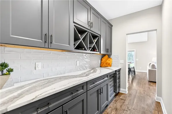a kitchen with stainless steel appliances granite countertop a sink and a stove
