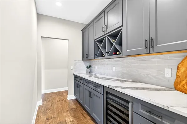 a kitchen with a sink and cabinets