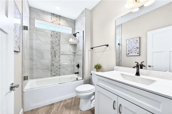 a bathroom with a sink a toilet and a bathtub