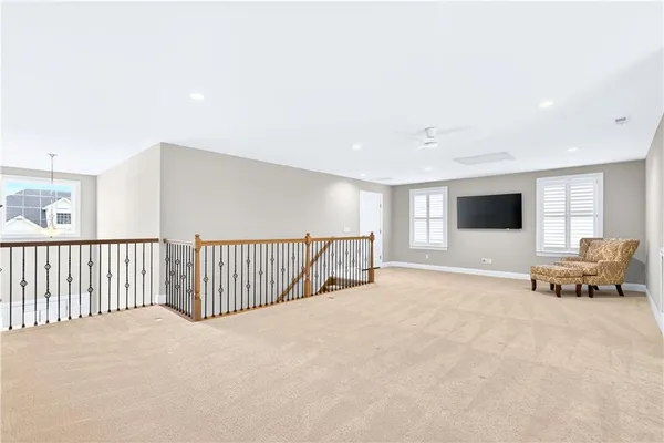 a view of a livingroom with furniture and a flat screen tv