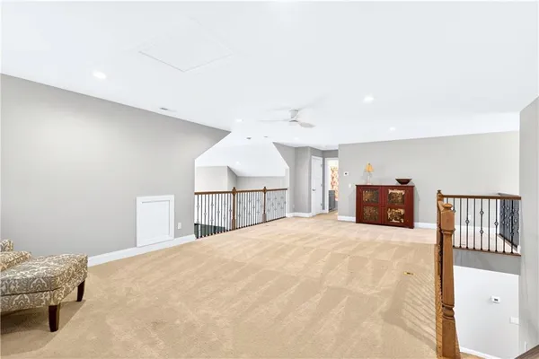 a large white bed in a white room