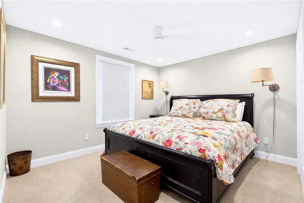 a bedroom with a bed and a cabinets