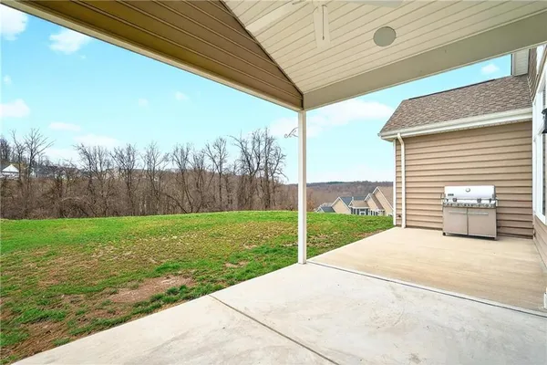 a view of a backyard with wooden fence