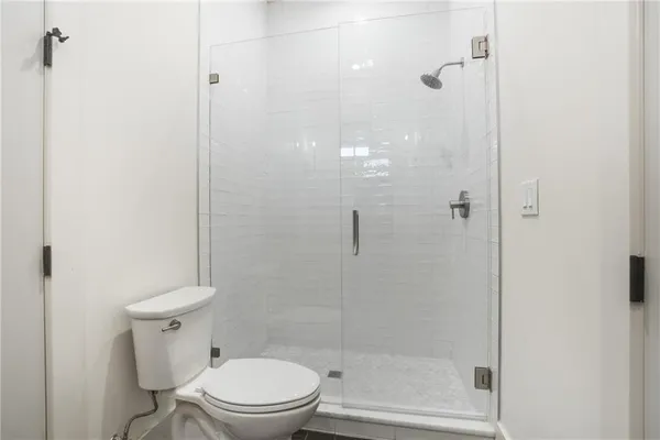 a bathroom with a shower and a sink