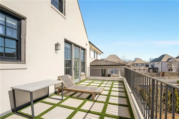 a view of a patio with a table and chairs