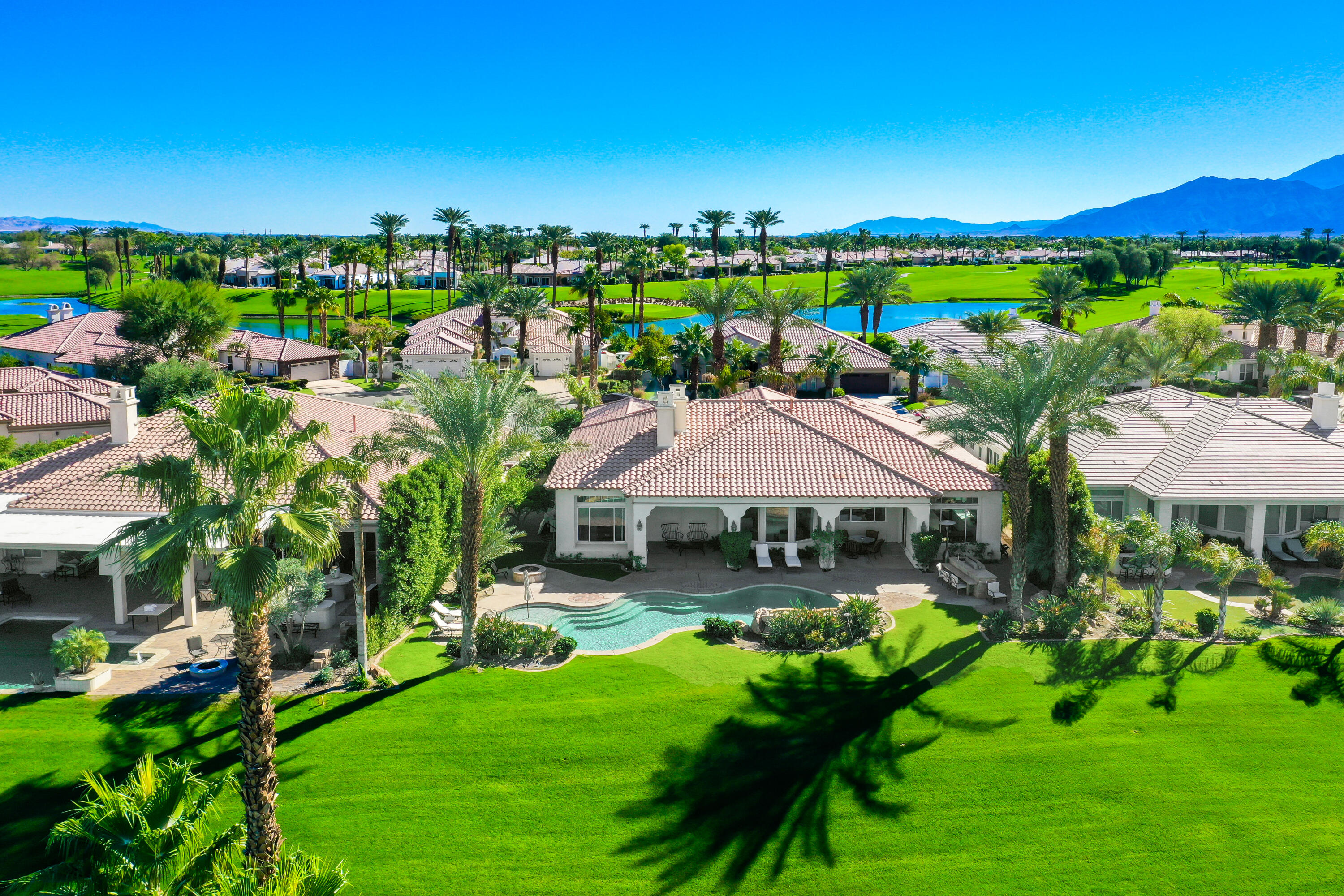a view of swimming pool and outdoor seating