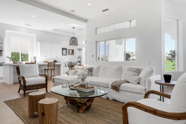 a living room with furniture and a table