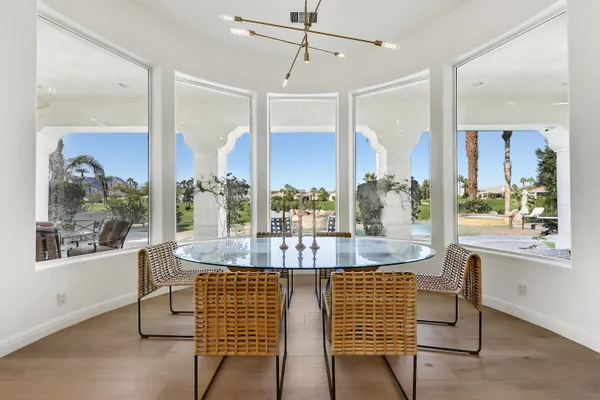 a view of a dining room with furniture window and wooden floor