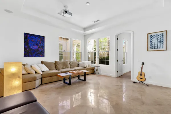a living room with furniture and a large window