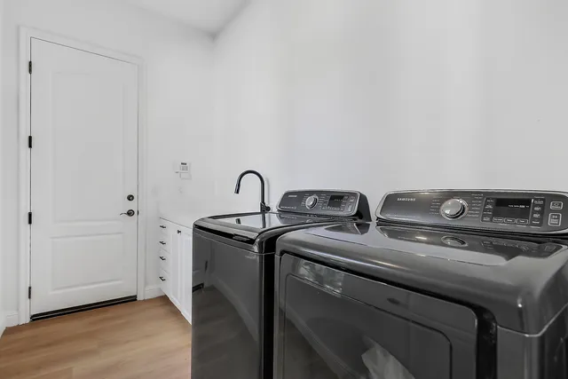 a utility room with dryer and washer