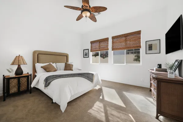a bedroom with a bed and cabinets