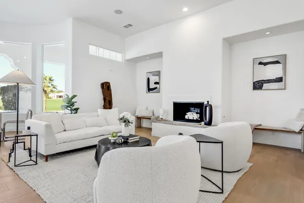 a living room with furniture and a fireplace