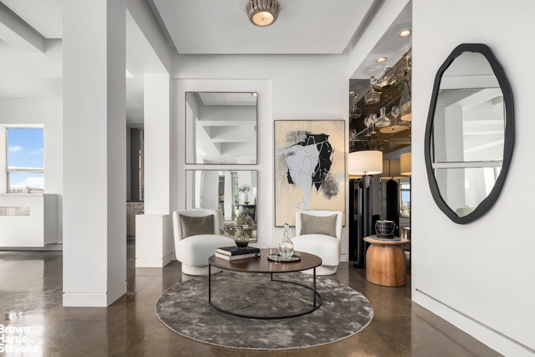 880 5th Avenue, Unit PHF Manhattan, NY 10021 - Photo 4 of 16 a living room with furniture and a mirror