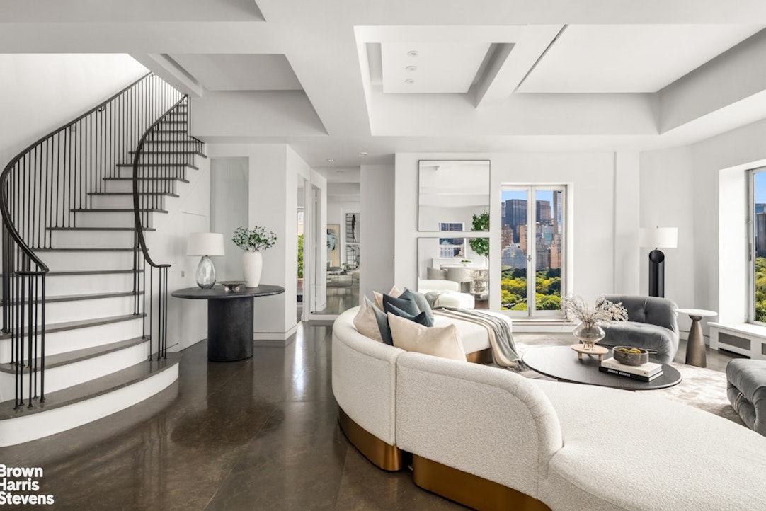 880 5th Avenue, Unit PHF Manhattan, NY 10021 - Photo 7 of 16 a living room with furniture kitchen view and a large window