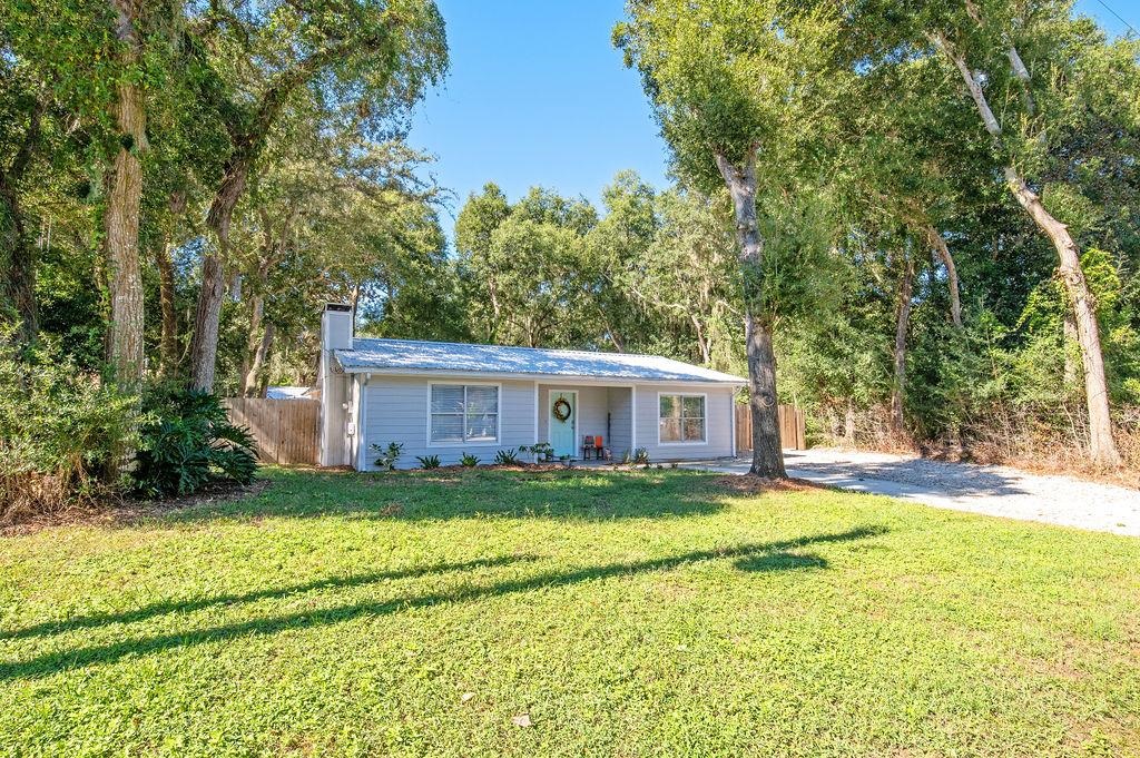 436 Orchis Road St. Augustine, FL 32086 - Photo 1 of 39 a view of a house with a big yard and large trees
