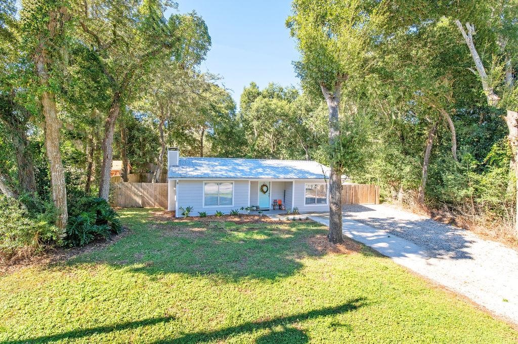 436 Orchis Road St. Augustine, FL 32086 - Photo 2 of 39 a view of a house with a big yard plants and large trees