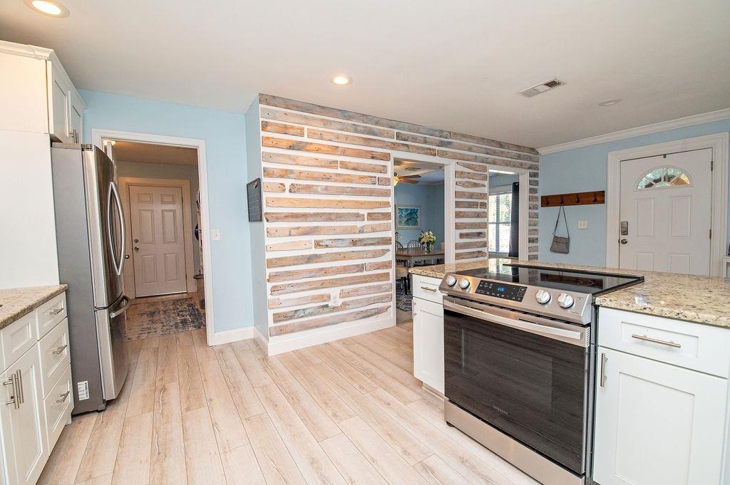 436 Orchis Road St. Augustine, FL 32086 - Photo 18 of 39 a kitchen with a stove oven and sink