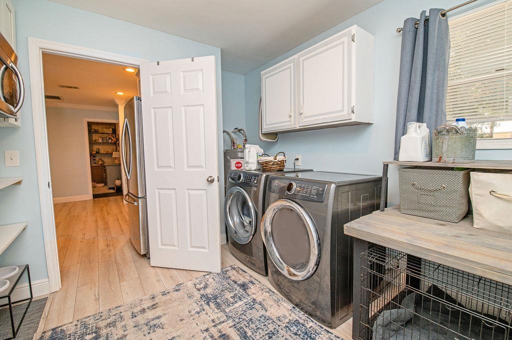 436 Orchis Road St. Augustine, FL 32086 - Photo 21 of 39 a view of a storage and utility room with washer and dryer