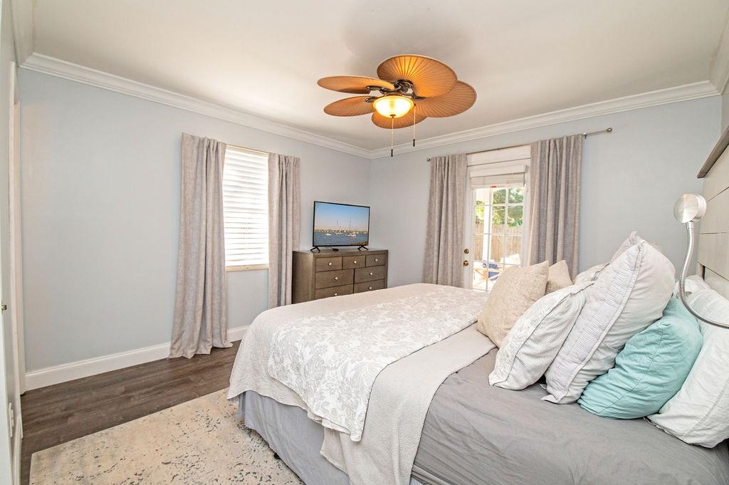 436 Orchis Road St. Augustine, FL 32086 - Photo 26 of 39 a bedroom with a bed and a chandelier