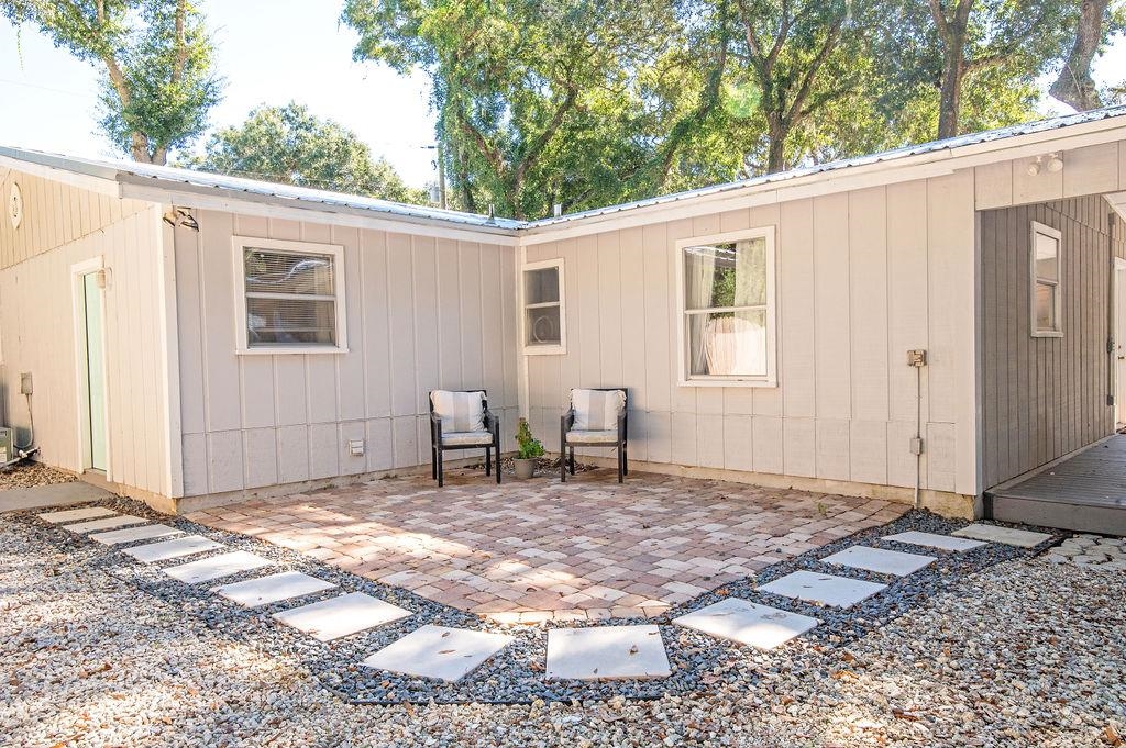 436 Orchis Road St. Augustine, FL 32086 - Photo 6 of 39 a backyard of a house with table and chairs