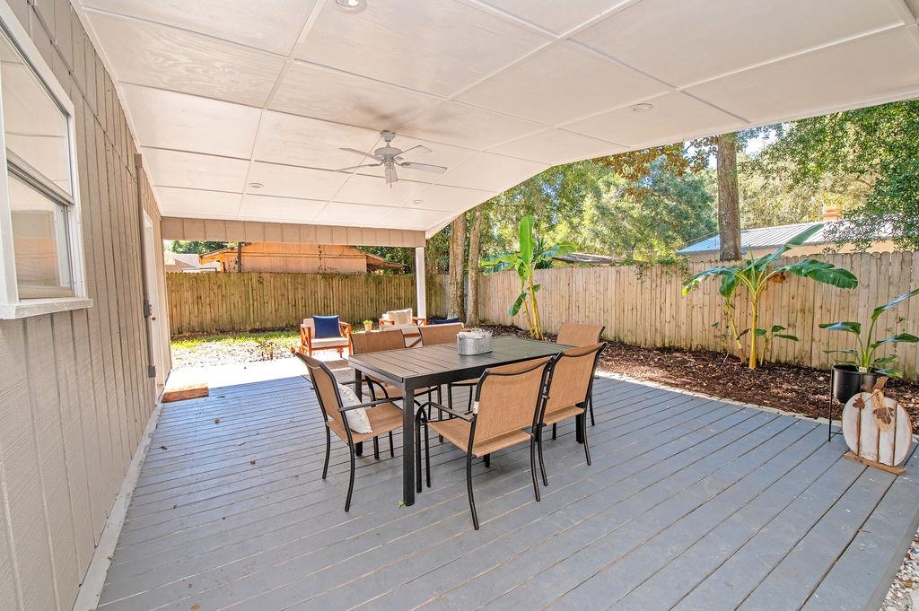 436 Orchis Road St. Augustine, FL 32086 - Photo 8 of 39 a outdoor dining space with furniture and wooden floor