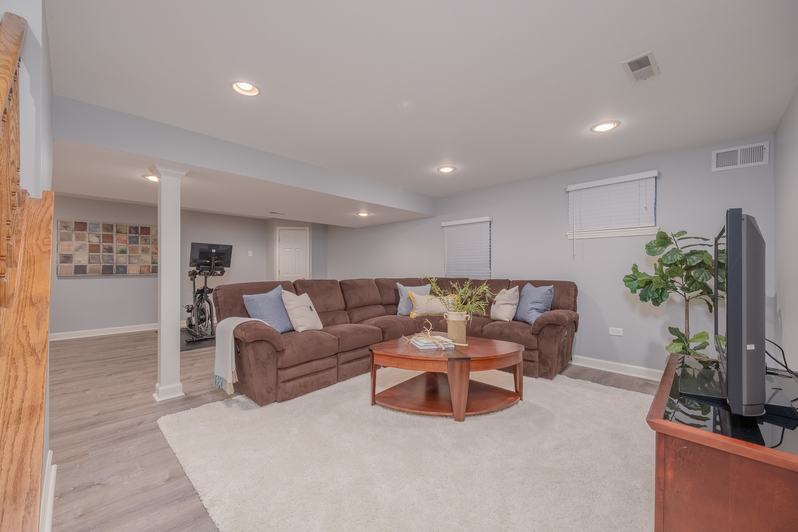 2410 Highland Road Geneva, IL 60134 - Photo 15 of 26 a living room with furniture potted plant and a flat screen tv